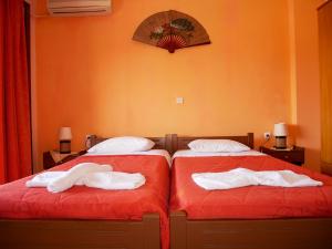 Postel nebo postele na pokoji v ubytování Hotel Olga