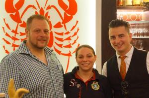 two men and a woman posing for a picture at Minihotel Graz in Graz