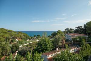 a view of a town with the ocean in the background at Apartment Beach Front Sant Pol in San Pol de Mar