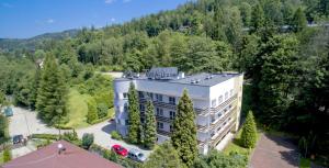 an aerial view of a large building in the woods at Rezydencja Izabella in Wisła