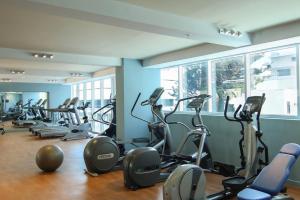 a gym with a bunch of exercise bikes in a room at The Executive Hotel in Panama City