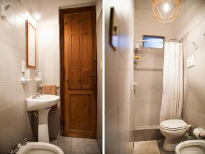 a bathroom with a toilet and a sink and a toilet istg at Casa Helsinki in Cordoba +25 photos
