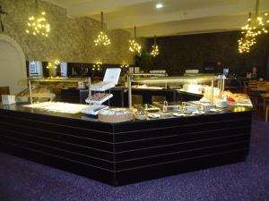 a buffet line with many different types of food at Abdij Hotel Rolduc in Kerkrade