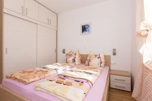 Postel nebo postele na pokoji v ubytování Villa Janja