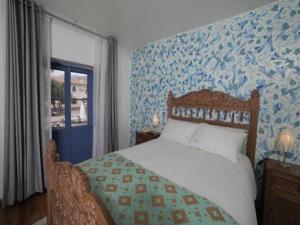 Cama ou camas em um quarto em Posada Villa Mayor