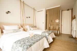 a bedroom with two beds and a window at Aelia Wellness Retreat in Nicosia