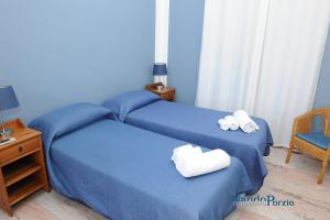 Letto o letti in una camera di B&B Villa Delle Rondini