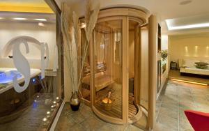 a store window with a bench in a room at Iakovakis Suites & Spa in Koropi