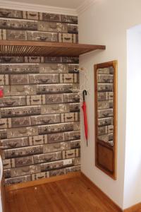 a wall made out of logs at Casa d Sintra in Sintra