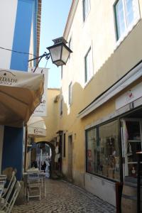 an alley with a street light next to a building at Casa d Sintra in Sintra
