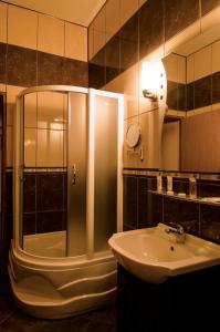 a bathroom with a shower and a sink at Iris Villa in Vatra Dornei +42 photos