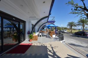 a building with tables and chairs on a street at Kenting Coast Resort in Kenting