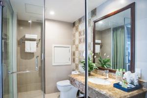 a bathroom with a sink and a toilet at Song Loc Luxury Hotel in Ha Long
