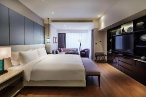 Postel nebo postele na pokoji v ubytování Taipei Fullerton Hotel-Maison North + 37 fotografií