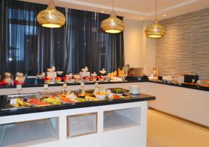 a buffet line with a lot of food on it at Eka Hotel Nairobi in Nairobi
