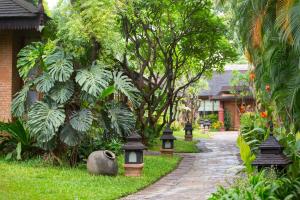 A garden outside The Hotel @ Tharabar Gate