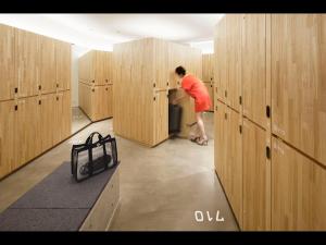 a person is standing in a locker room at 9h nine hours woman Kanda in Tokyo