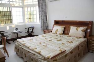 Postel nebo postele na pokoji v ubytování Xiang Pin Yuan Homestay + 15 fotografií