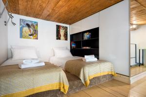 A bed or beds in a room at Main Square One Minute by Otium