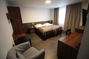 Postel nebo postele na pokoji v ubytování Motel SEO Muonio