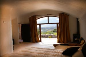 Lova arba lovos apgyvendinimo įstaigoje Hotel Rural & Spa Las Nubes