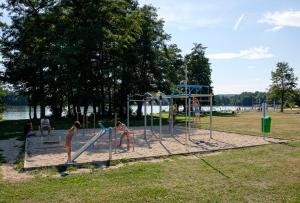 a park with a lot of benches and a fence at BeachCamp Nová Role in Nová Role