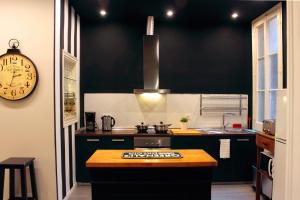 Kuchyň nebo kuchyňský kout v ubytování Casa Consell Apartments