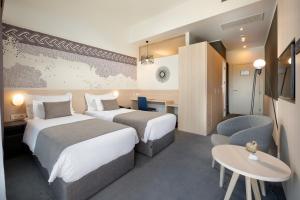 Postel nebo postele na pokoji v ubytování Hotel Salona Palace
