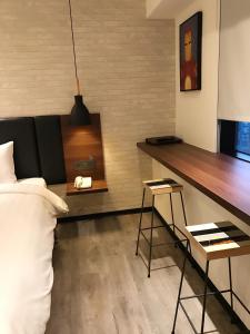 Postel nebo postele na pokoji v ubytování Goldinn Hotel