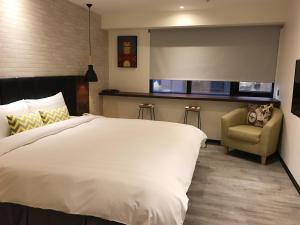 Postel nebo postele na pokoji v ubytování Goldinn Hotel