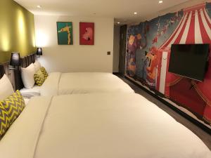 Postel nebo postele na pokoji v ubytování Goldinn Hotel