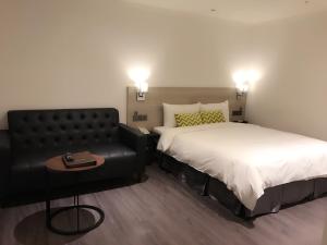 Postel nebo postele na pokoji v ubytování Goldinn Hotel