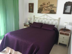 เตียงในห้องที่ Atico Costa Ballena golf y playa parking&wifi