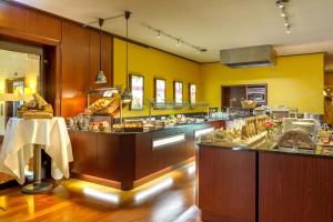 a large kitchen with a buffet of food at Hotel Krefelder Hof in Krefeld