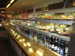 a display case in a store with food and drinks at Rasta Kalmar in Kalmar