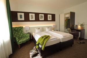 Ένα ή περισσότερα κρεβάτια σε δωμάτιο στο Hotel Haus Schons
