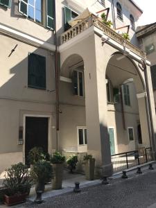 a large building with an archway in front of it at B&B Casa Fenoglio in Ventimiglia