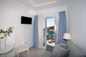 Uma TV ou centro de entretenimento em Hotel Anna