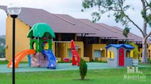 a playground in front of a building with at Winterville Flats Gravatá in Gravatá