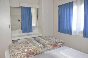 Voodi või voodid majutusasutuse Camping Adamello toas