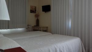 Posteľ alebo postele v izbe v ubytovaní Hotel Valdelinares (Soria)