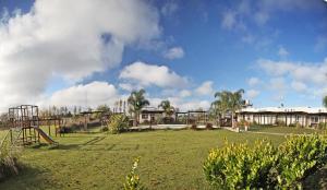 a park with a playground with a slide at Las Mentas in Victoria