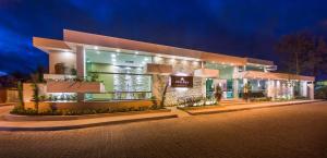 a large building with lights on it at night at Vitoria Regia Praia Hotel in Porto Seguro