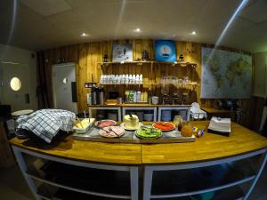 a kitchen with a table with food on it at Äventyrscampen in Sjöbo