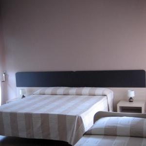 Letto o letti in una camera di B&B 5 Sensi