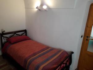 Кровать или кровати в номере Antica Casa in Pietra