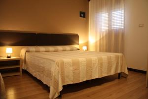 Letto o letti in una camera di B&B 5 Sensi