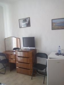 a room with chairs and a desk with a computer at FeoAlex in Koktebel