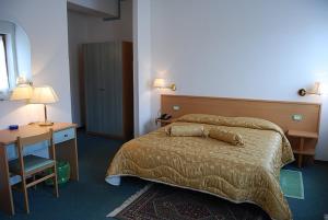 Postel nebo postele na pokoji v ubytování Hotel Etruria