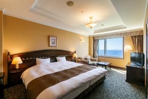 Säng eller sängar i ett rum på Hotel Neu Schloss Otaru